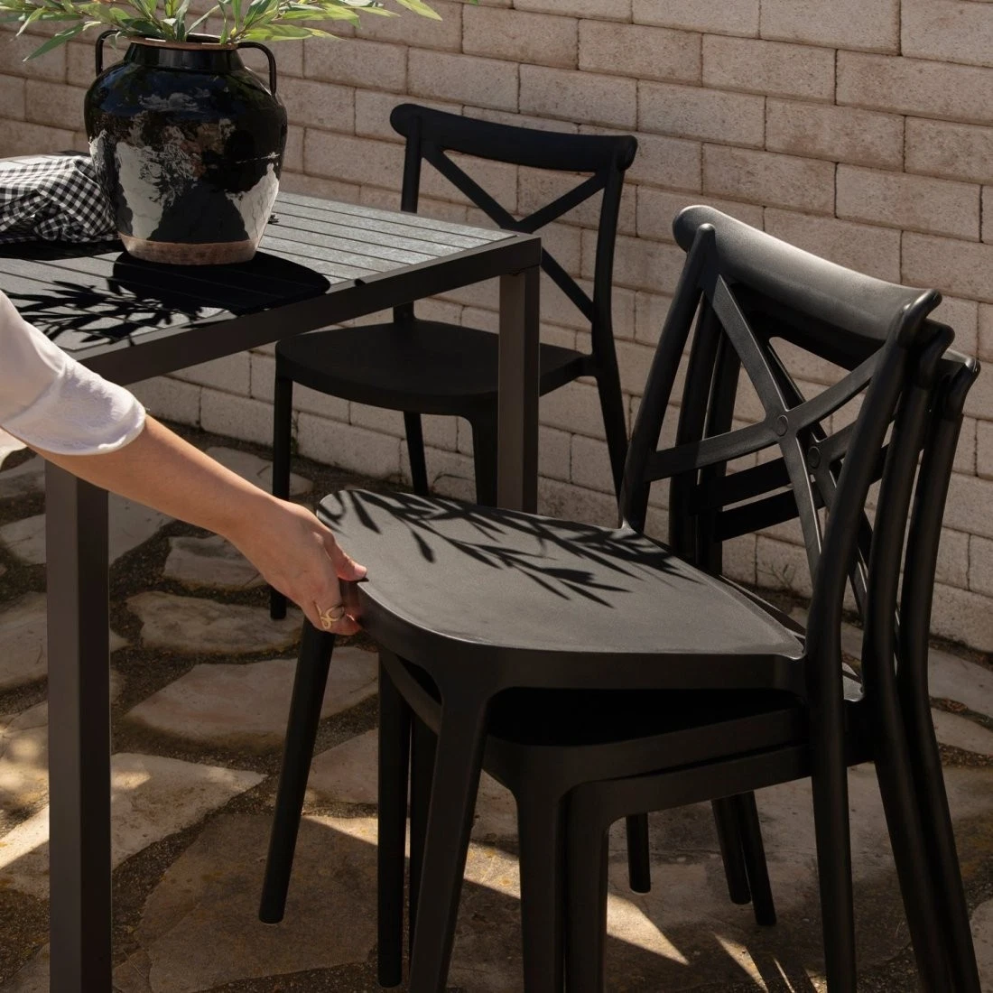 Plastic stacking garden dining chair black