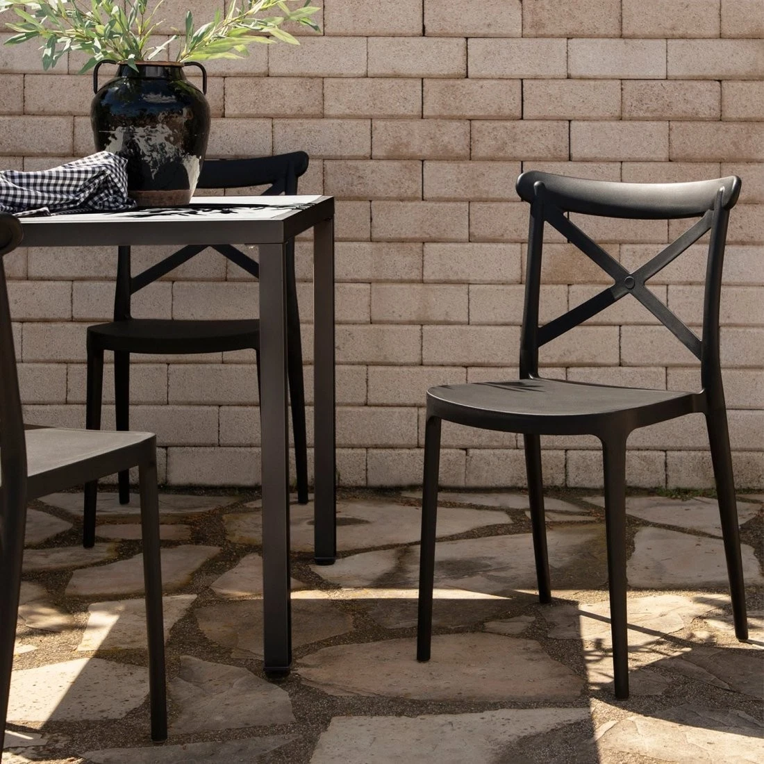 Plastic stacking garden dining chair black